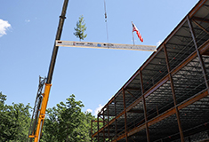 Reveler Development and Penobscot General Contractors celebrate topping out at 60 Barra Rd. in Biddeford, ME