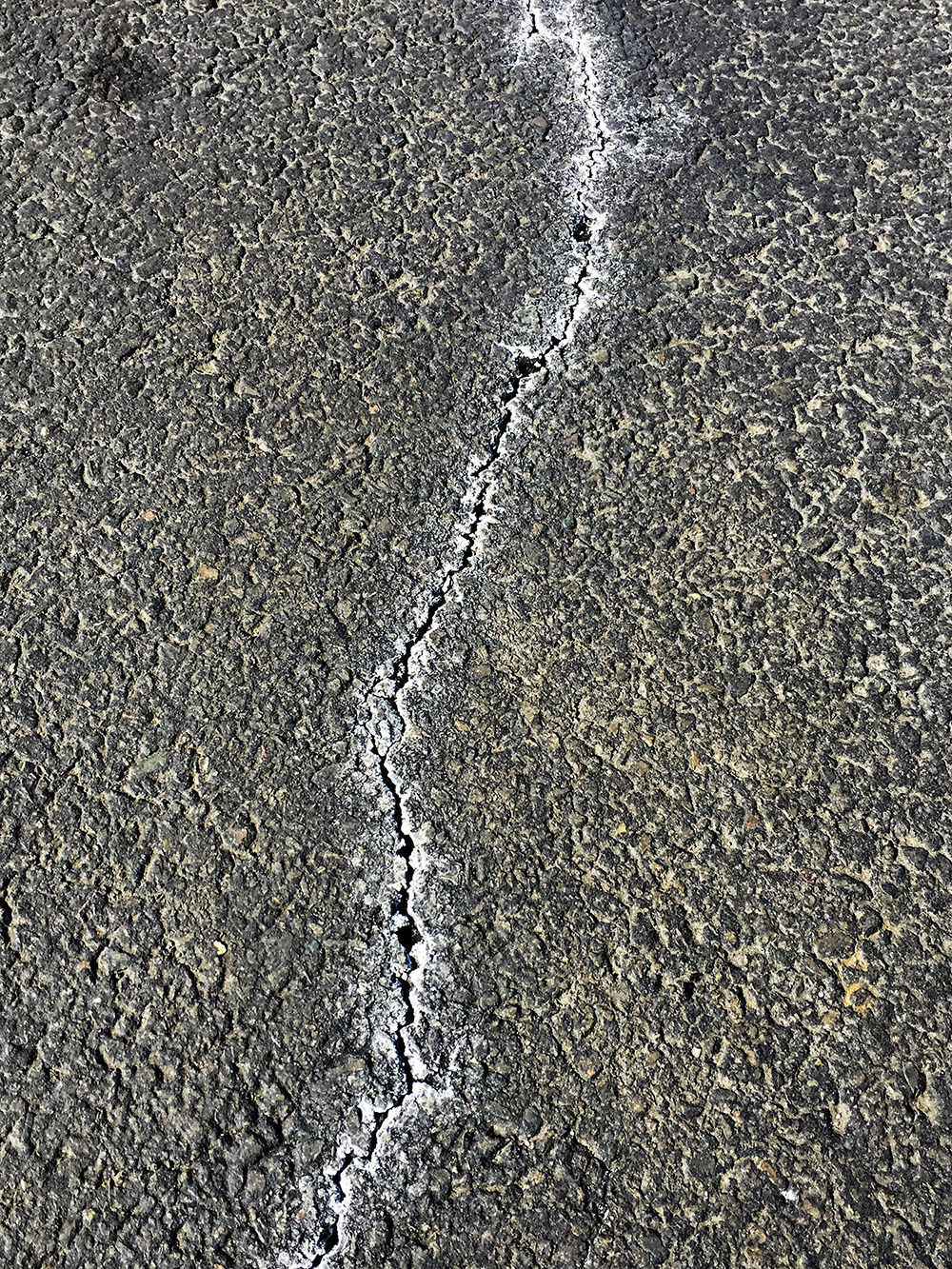 White spots that appear in pavement and what they are - by Craig Swain