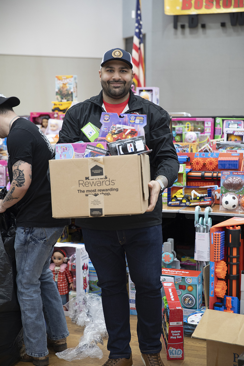 Local 103 electrical workers donate toys and winter clothes to children ...