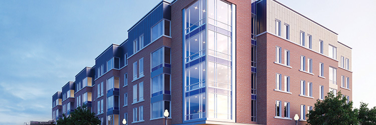 Landry/French Construction tops off $25.5 million mixed-use development building designed by Ayers Saint Gross