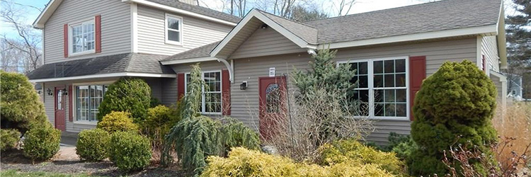 Lyman, Parker and MacCormack of Lyman Real Estate handle multiple deals - including $450,000 building sale; 5,500 s/f in two leases