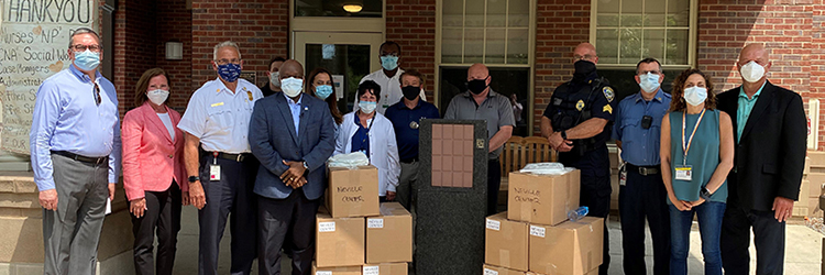 Local companies and banks work together to donate reusable protective gowns  to nursing homes