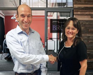 Shown are Fox RPM president Peter Stein and BRG’s president and CEO Traci Doane 