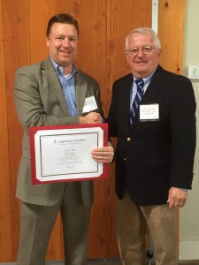 Scott Rand of Integra Realty Resources with MAI certificate