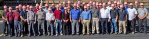 Shown are employees at Building Technology Engineers, Inc. wearing Pink Hard Hats as a “Call to Action” for EMCOR’s 7th Annual Protect Yourself. Get Screened Today.” campaign. BTE employees proudly pose wearing their EMCOR Pink Hard hats at the company’s headquarters office in Stoneham, Mass.