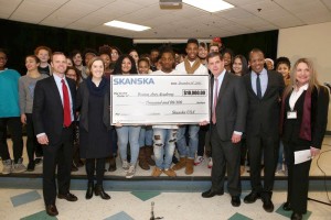 Shown (from left) are: Skanska vice president of development Charles Leatherbee; Boston Arts Academy headmaster Anne Clark; mayor Martin Walsh; Emerson College president and BAA board of directions president Lee Pelton; senior deputy superintendent Barbara Deane-Williams from the Boston Public Schools and BAA choir students.