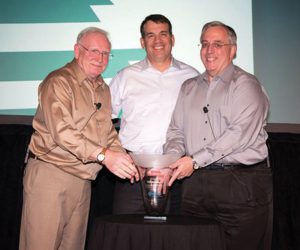 Shown are Tony Guzzi, president & CEO, EMCOR; Bill Boyd, senior vice president, risk control, CNA; and David Copley, vice president, safety & quality management, EMCOR.