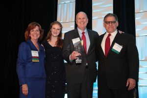 Shown is the 2015 Executive of the Year, Dana Warren, Federal Reserve Bank of Boston, accepting his Award alongside 2015 BOMA Boston president, June Cunniff, A.W. Perry, Inc.; Dana’s daughter, Katherine Warren; and 2016 BOMA president-elect, Jim DerMinasian, Taurus Management Services at last year’s TOBY & Industry Awards. 