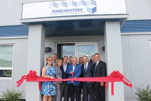 Shown (from left) are: Karen Weston, mayor of Dover, NH; Rick Dumais, general manager, Rand-Whitney Container; N.H. governor Maggie Hassan; Daniel Kraft, President-International of The Kraft Group; Michael Bergeron – business development manager, N.H. DRED; Robert Kraft, founder, chairman and CEO of The Kraft Group; John Samenfeld, vice chairman PROCON Design-Build; Jonathan Kraft, president of the Kraft Group; Jim Bauchiero, SVP sales and marketing, Rand-Whitney Container; and Nick Smith president/CEO, Rand-Whitney Container.
